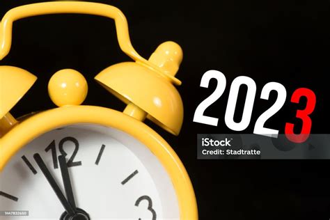 An Alarm Clock And Turn Of The Year 2023 Stock Photo - Download Image ...