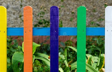 Multi Colored Rainbow Wooden Fence In Garden Stock Image Image Of