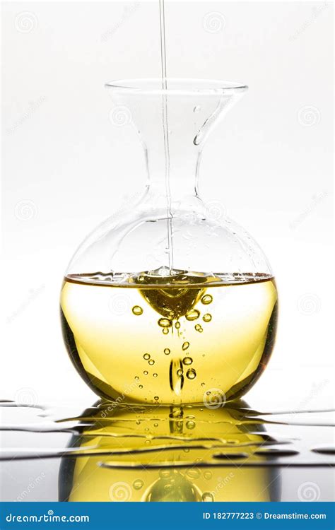 Pouring Olive Oil Into A Glass Bottle Stock Image Image Of Glassware