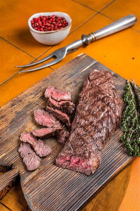 Grilled Medium Rare Machete Or Skirt Beef Meat Steak On Wooden Cutting