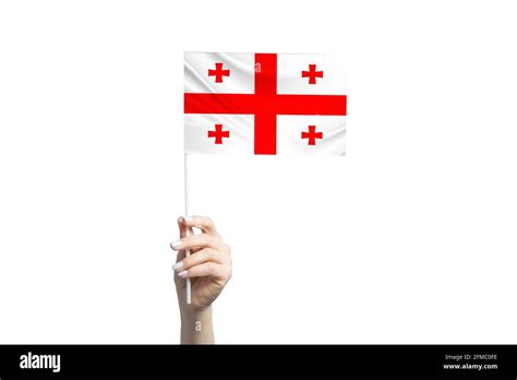 Beautiful Female Hand Holding Georgia Flag Isolated On White