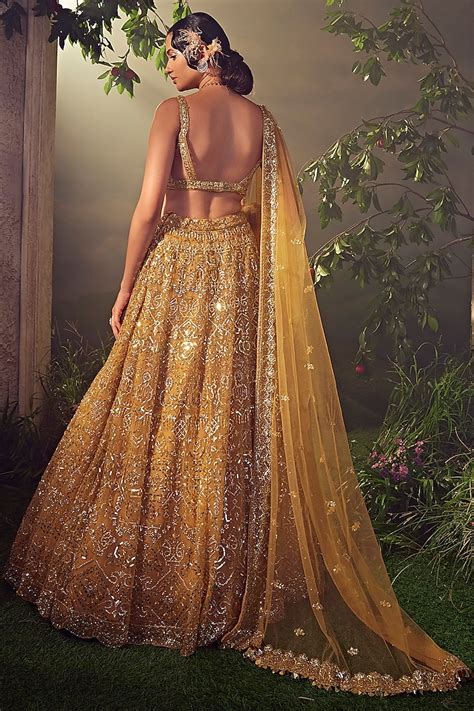 Amber Gold Tulle Embroidered Bridal Lehenga Set By Aneesh Agarwaal At