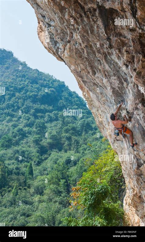 Male climber climbing at Odin's Den next to Moon Hill in Yangshuo ...