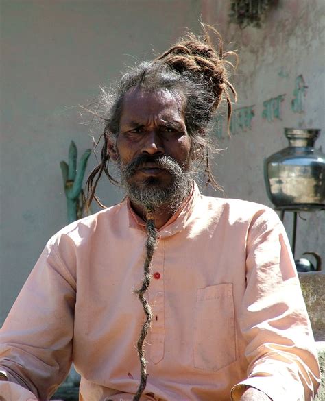 man  dreadlocks sitting outdoors  stock photo freeimages