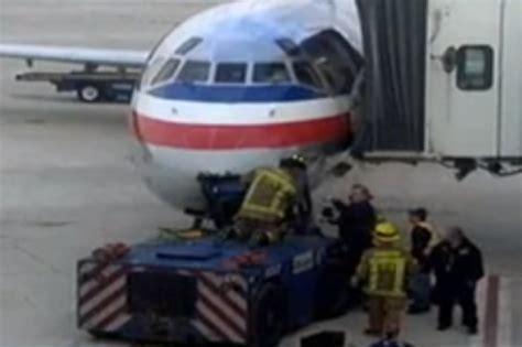 American Airlines Flight Cancelled After Tow Truck Crashes Into Plane