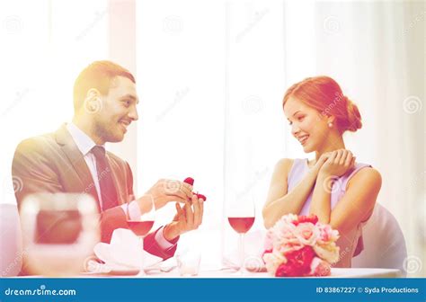 Man Proposing To His Girlfriend At Restaurant Stock Image Image Of