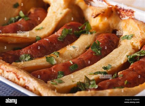 Traditional English Dish Toad In The Hole Macro Horizontal Stock Photo