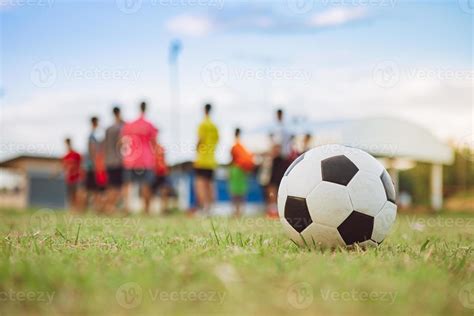 Action Sport Outdoors Of A Group Of Kids Having Fun Playing Soccer