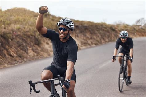 Premium Photo Winner Celebrating And Winning Cyclist Cycling With His