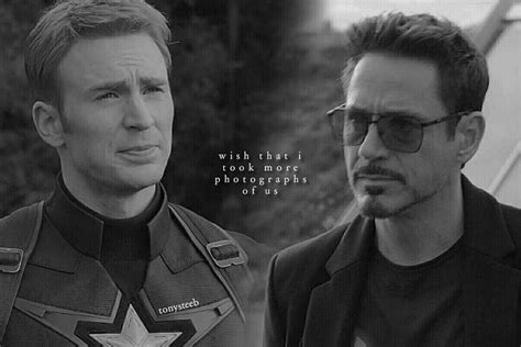 two men dressed in captain america uniforms, one is looking at the ...