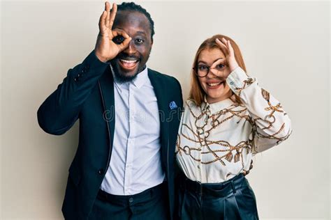 Young Interracial Couple Wearing Business And Elegant Clothes Doing Ok