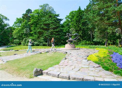 Tourists Near Sculpture Egle - Queen of Snakes in Botanical Park Editorial Photography - Image ...