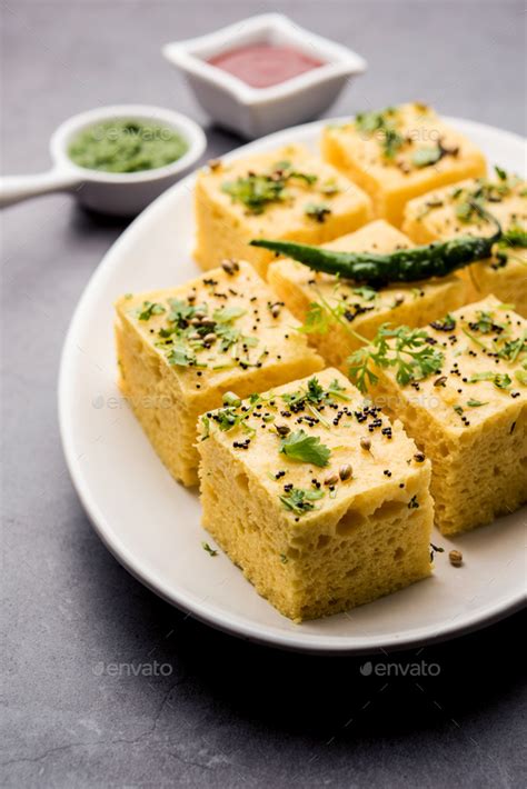 Gujarati Khaman Dhokla Or Steamed Gram Flour Puffy Snack Cake Stock