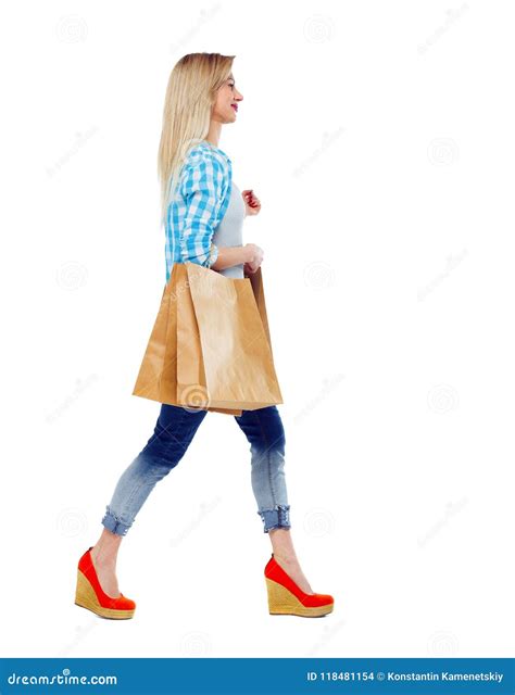 Side View Of A Woman Walking With Shopping Bags Stock Photo Image Of