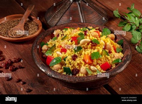 Moroccan Couscous In A Tagine With Ingredients Stock Photo Alamy