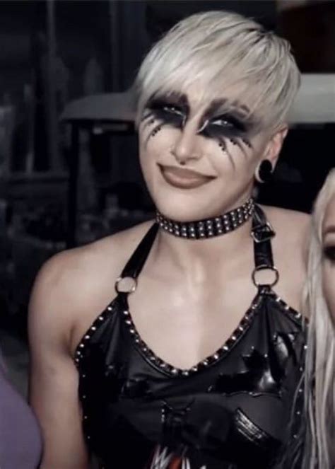 Two Women With Makeup On Their Faces Posing For The Camera