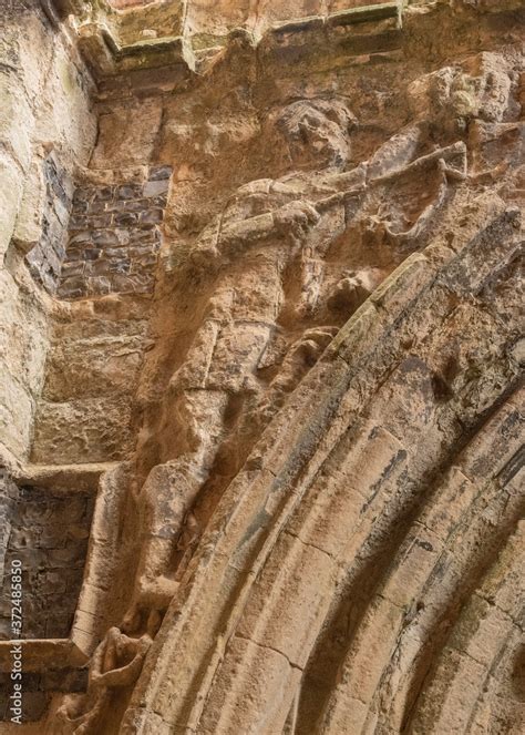 Carvings In The Old Stone Wall Of St Benets Abbey In Mid Norfolk