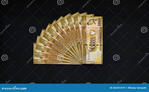 5000 Sri Lankan Rupee Notes Stack On A Black Background Making A