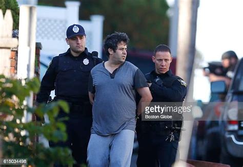 Swat Team Members Lead A Man From A Home On Francis Street In Revere