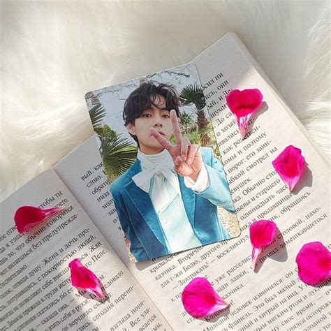 An Open Book With Pink Flowers On The Pages And A Photo Of Btopse