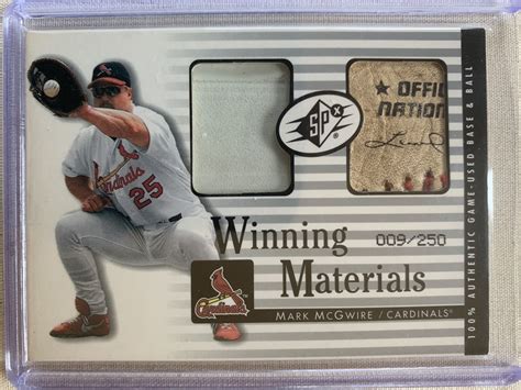 2000 UPPER DECK SPx WINNING MATERIALS BB MM1 MARK McGWIRE BALL BASE