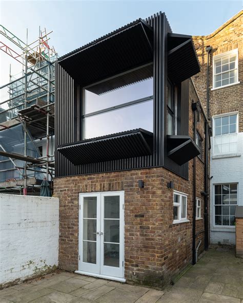 mata architects incorporates dynamic 'black box' extension into ...