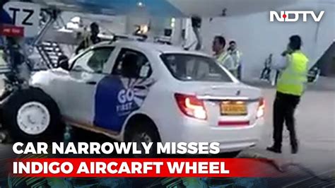 Watch Go First Car Passes Under Indigo Plane Narrowly Misses Wheel