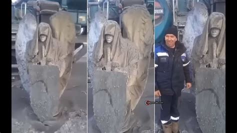 Mineros desentierran una estatua de ángel con escudo y espada en