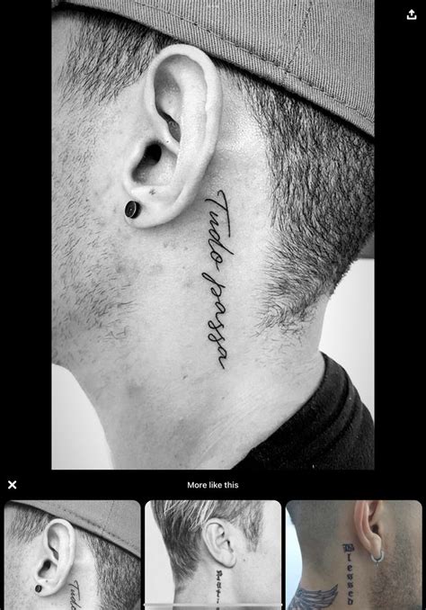 The Back Of A Man S Neck With Ear Piercings And Words On It