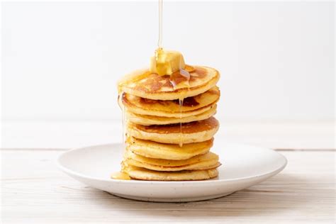 Premium Photo Pancakes With Butter And Honey