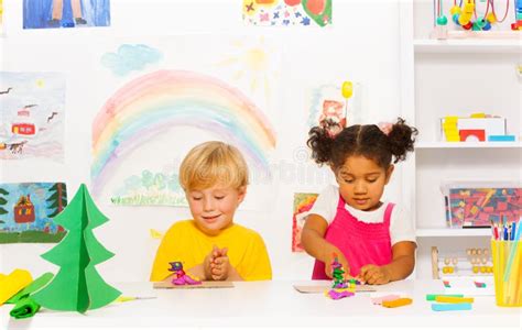 Boy And Girl Craft Together Forms Of Playing Dough Stock Image Image