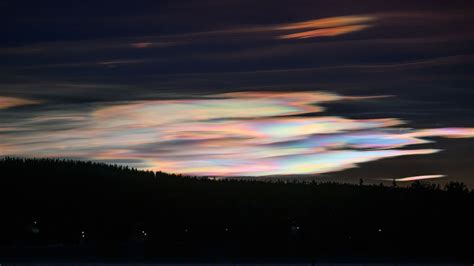 Spectacular 'rainbow clouds' light up northern skies in a rare ...