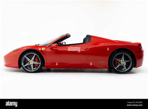 A Classic Red Ferrari Car On A White Background Illuminated By Bright