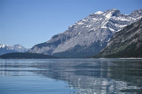 Lake Minnewanka Near Banff, Alberta, Canada Stock Photo - Image of ...