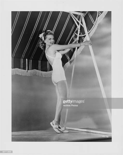 Portrait of actress Elyse Knox in a white bathing suit, circa... News