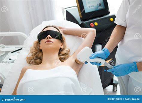 Beautiful Girl On A Laser Hair Removal Procedure Armpits In Cosmetology