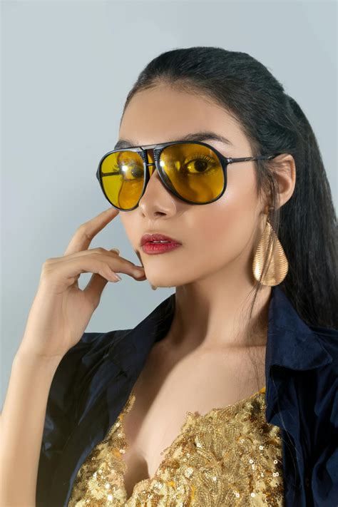 Young Models Posing in Dresses and Large Headdresses Outside · Free ... 