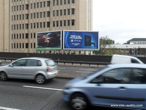 Interesting juxtaposition of competing gaming consoles, as seen on the A4 near Earls Court, with ...