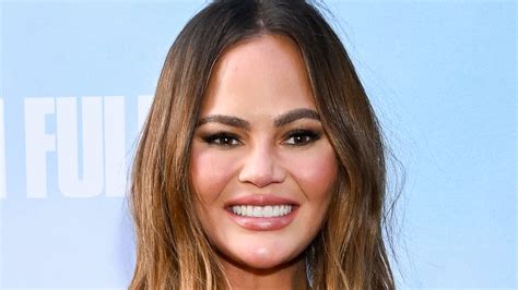 Chrissy Teigen Puts On Leggy Display In Sexy Polka Dot Dress As She And