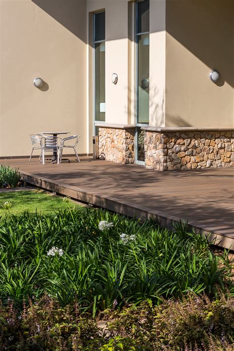 Composite Decking Over A Concrete Porch Gives A Backyard New Life