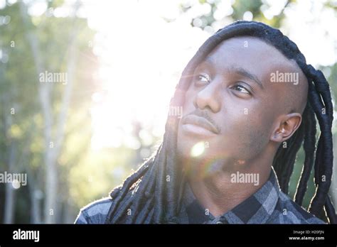 Young black man with dreadlocks, portrait Stock Photo - Alamy