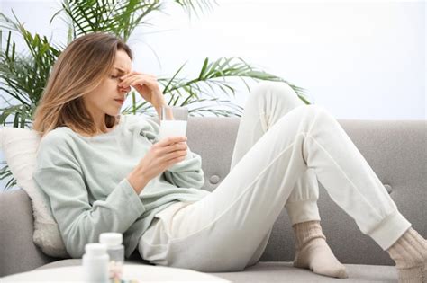 Premium Photo Woman Holding Glass Of Medicine For Hangover At Home