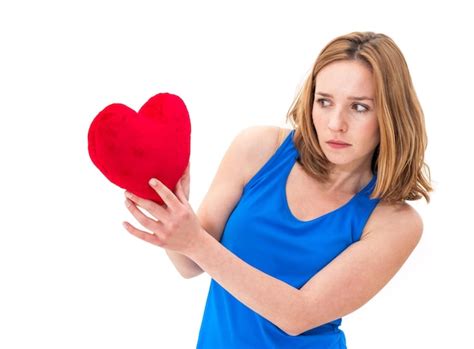 Premium Photo Beautiful Woman With Heart Shape Pillow Against White