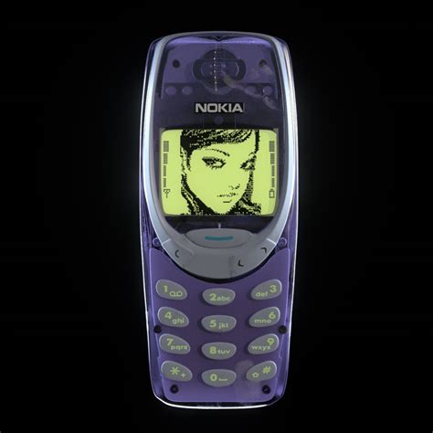 An Old Nokia Cell Phone With The Image Of A Womans Face On It