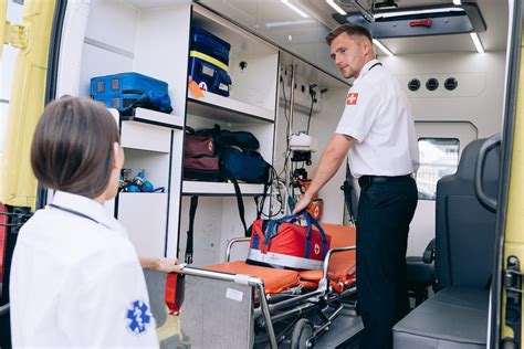 A Paramedic Man Inside the Ambulance · Free Stock Photo