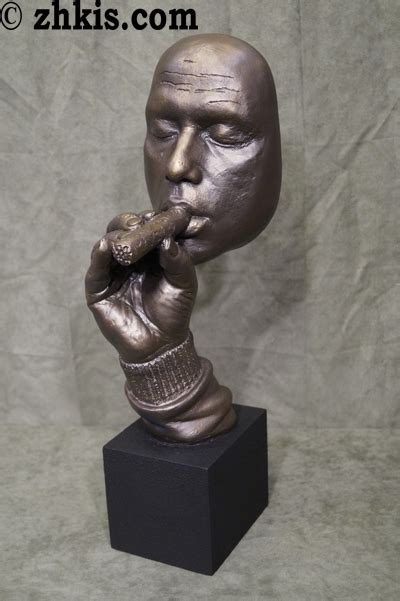 Man Smoking Cigar Statue