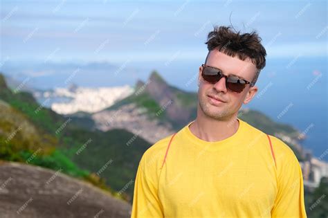 Premium Photo Handsome Man In Sunglasses Smiles On Background Of