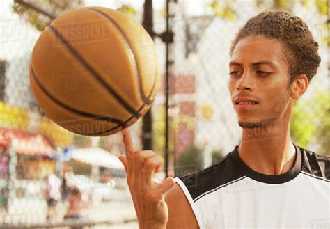 Man Spinning Basketball On Finger Stock Photo Dissolve