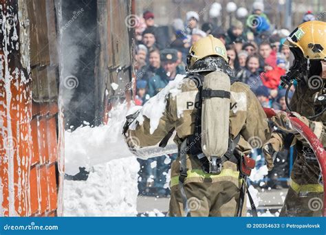 Firefighters Extinguishing Fire From Fire Hose Using Fire Fighting