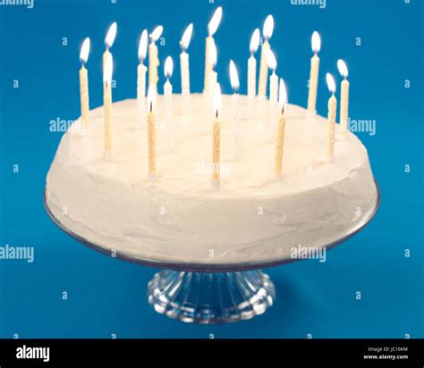 Birthday Cake With Burning Candles On Blue Background Stock Photo Alamy